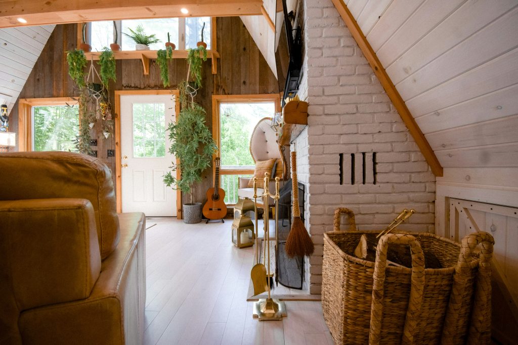 White shiplap accent wall with floating wooden shelves and small rustic decor pieces