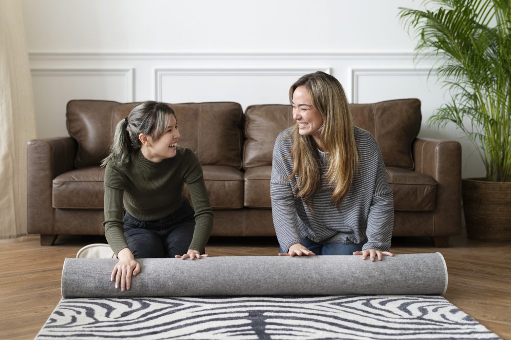 A cozy living room with a correctly sized area rug under the furniture