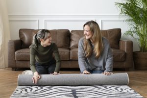 A cozy living room with a correctly sized area rug under the furniture