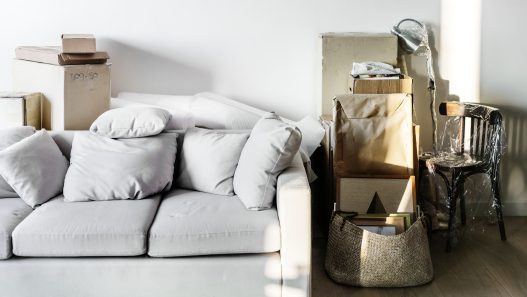Illustration showing budget-friendly ways to upgrade a rental home with new paint, minimalist decor, and affordable furniture.