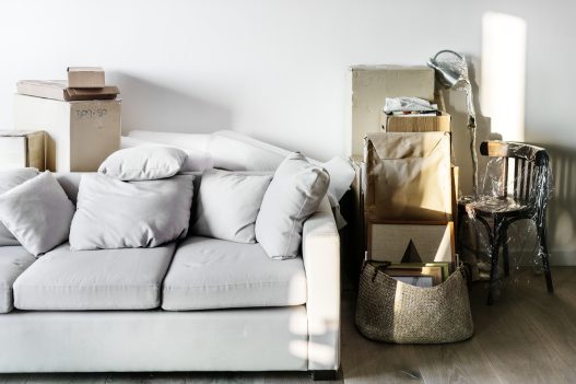 Illustration showing budget-friendly ways to upgrade a rental home with new paint, minimalist decor, and affordable furniture.