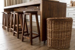 Affordable modern bar stools under $100 lined up at a kitchen island