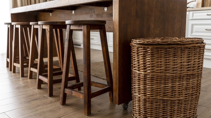 Affordable modern bar stools under $100 lined up at a kitchen island