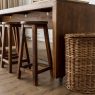 Affordable modern bar stools under $100 lined up at a kitchen island
