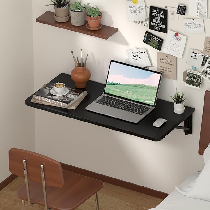 Modern foldable wall-mounted desk in a small apartment, folded down to create a compact workspace.