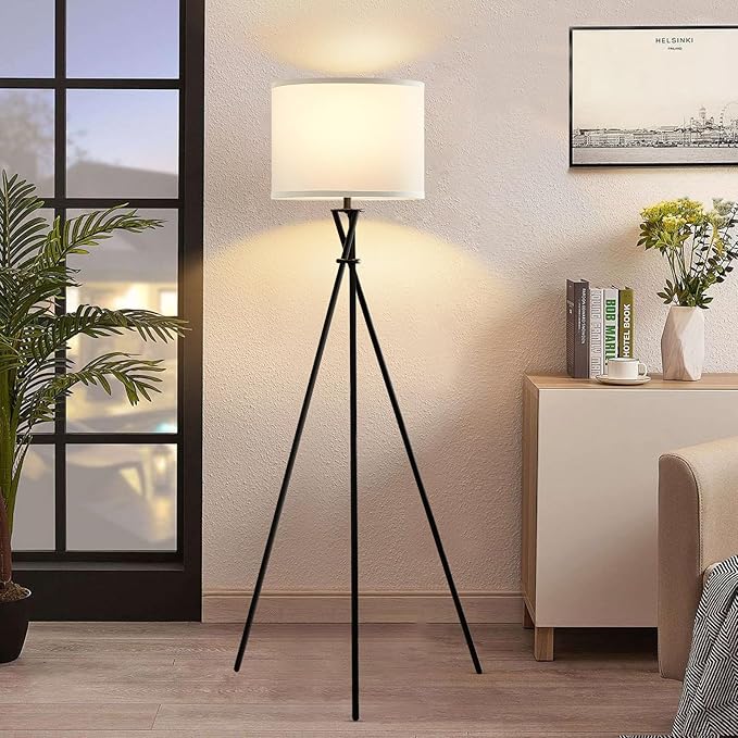 Layered lighting with floor lamps and table lamps in a cozy small living room