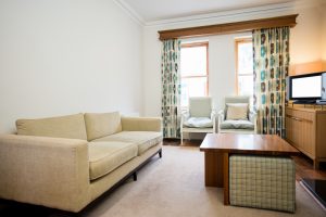 Modern small apartment interior featuring space-saving furniture and stylish decor to maximize limited living space