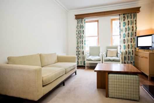 Modern small apartment interior featuring space-saving furniture and stylish decor to maximize limited living space