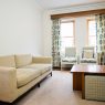 Modern small apartment interior featuring space-saving furniture and stylish decor to maximize limited living space